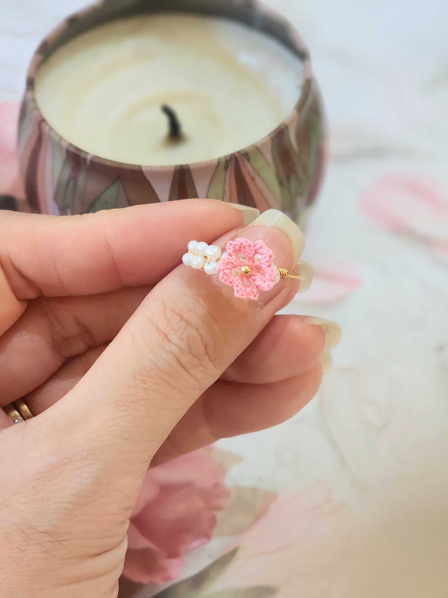 Band of pearls with handcrafted micro-crochet Sakura ring. Set on 14K gold-plated adjustable ring.