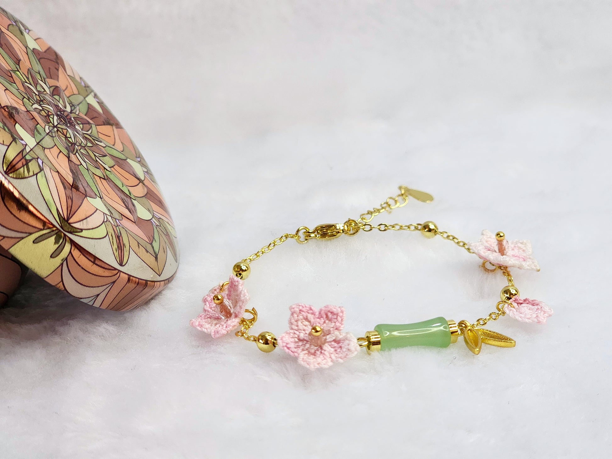 Natural Hetian Jade bracelet with handcrafted pink micro-crochet peach blossoms on 916 gold bracelet