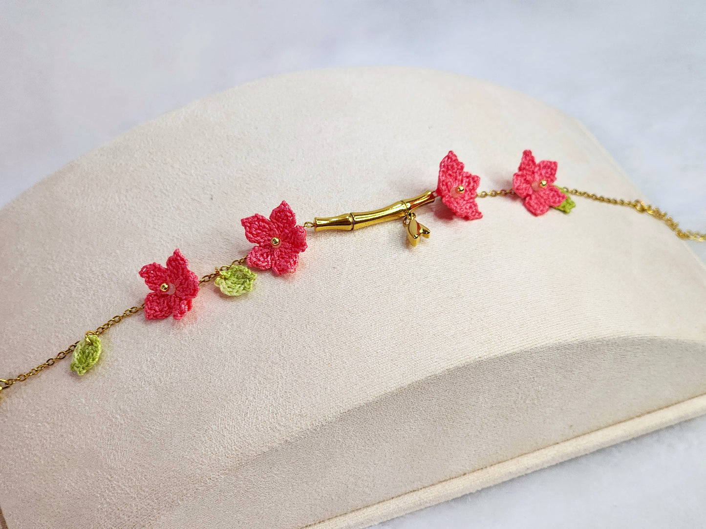 916 gold bamboo bracelet with handcrafted pink micro-crochet peach blossoms