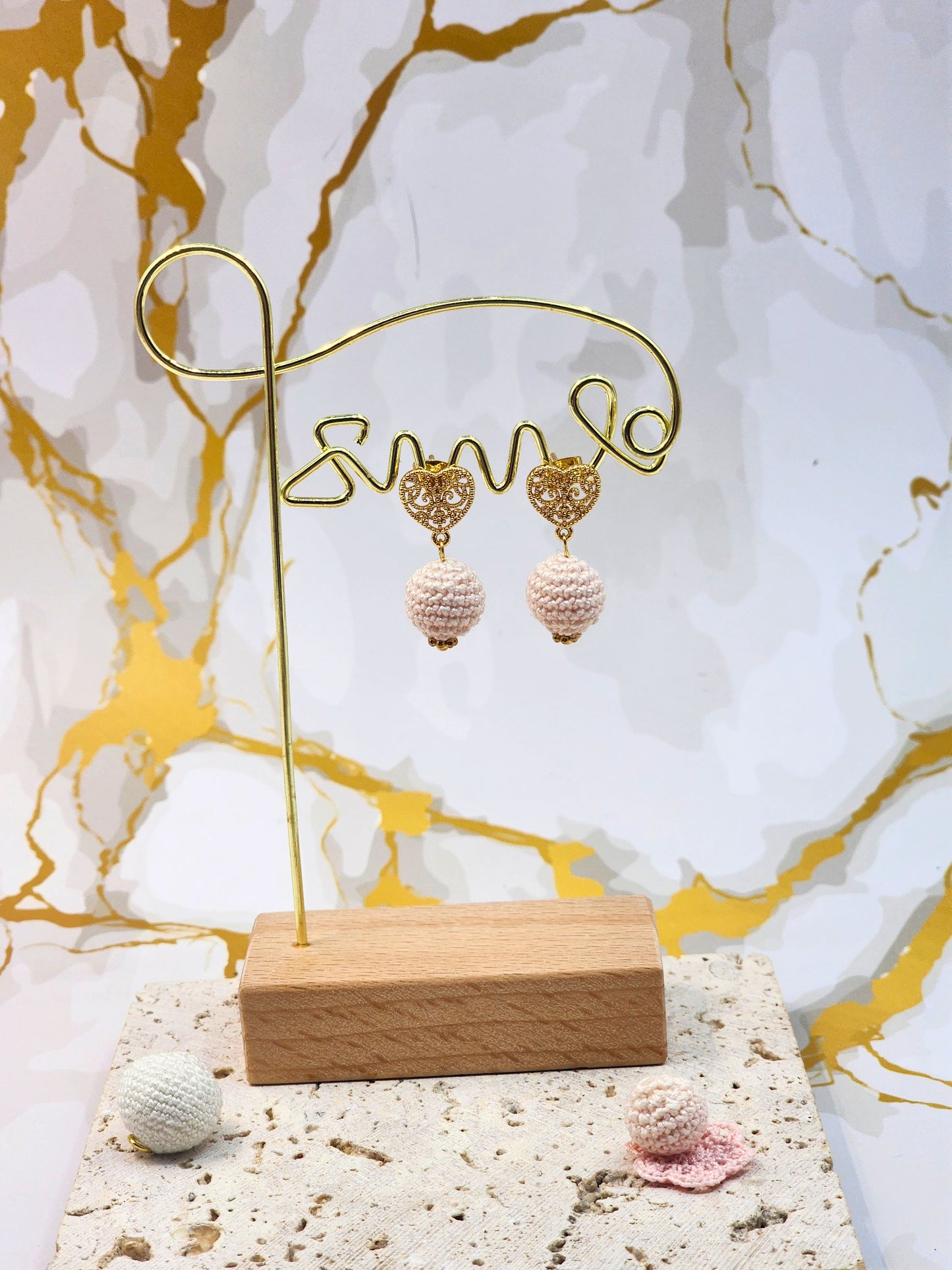 Handcrafted light pink crochet pearls inspired by the luminous beauty of Japanese seawater pearls. Styled with 18K gold-plated lace heart studs.