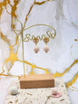 Handcrafted light pink crochet pearls inspired by the luminous beauty of Japanese seawater pearls. Styled with 18K gold-plated lace heart studs.