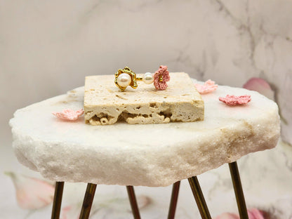 High lustre freshwater Akoya pearls ring. Accented with a singular pink micro crochet Sakura bloom. 18K gold-plated adjustable band. 