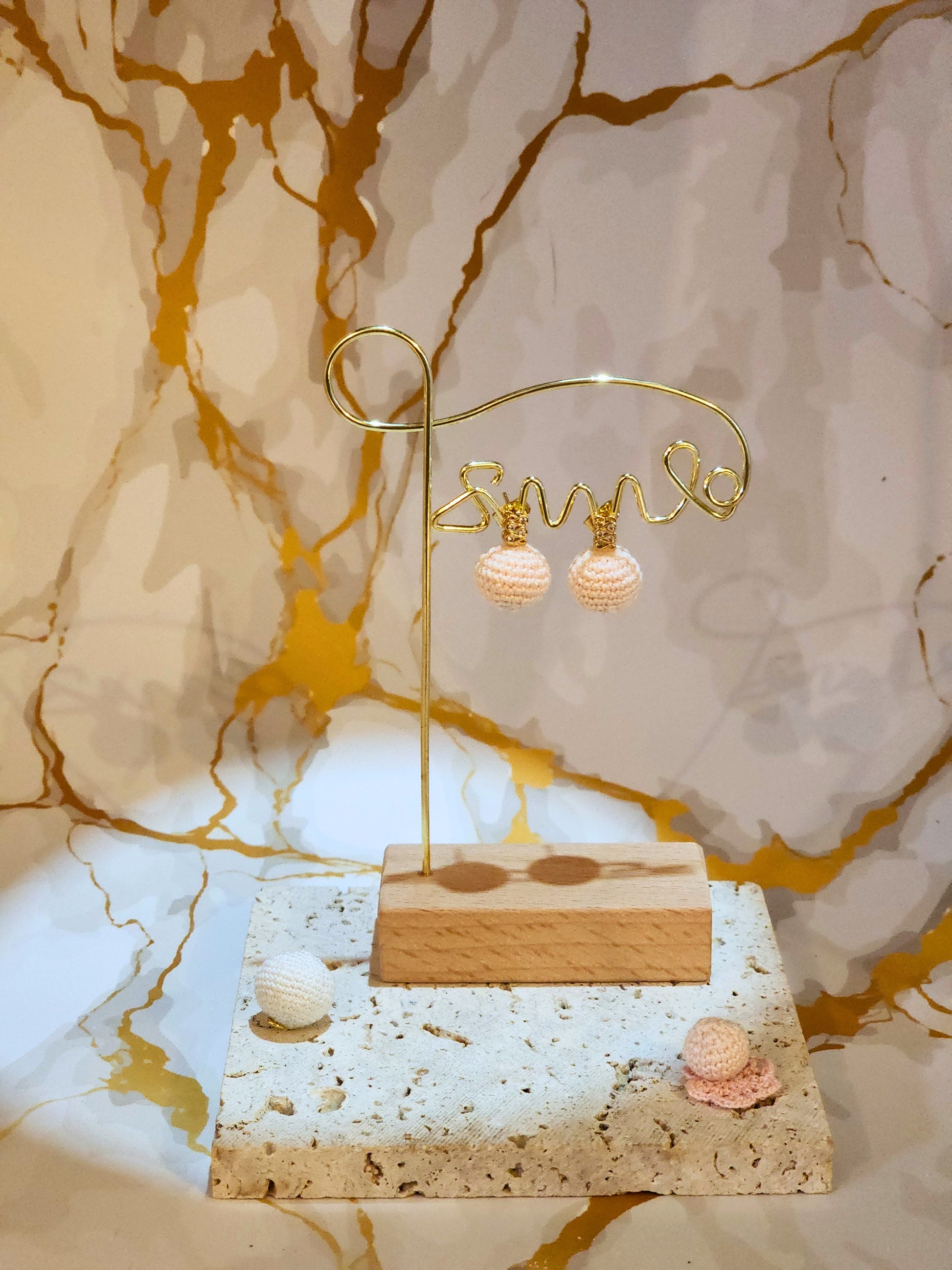 Handcrafted light pink crochet pearls inspired by the luminous beauty of Japanese seawater pearls. Styled with 18K gold-plated cubic zirconia studs.