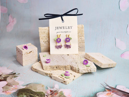 Natural Amethyst earrings with handcrafted micro‑crochet Lily of the Valley adorned with natural 4.5-5mm smoke grey freshwater pearls. 