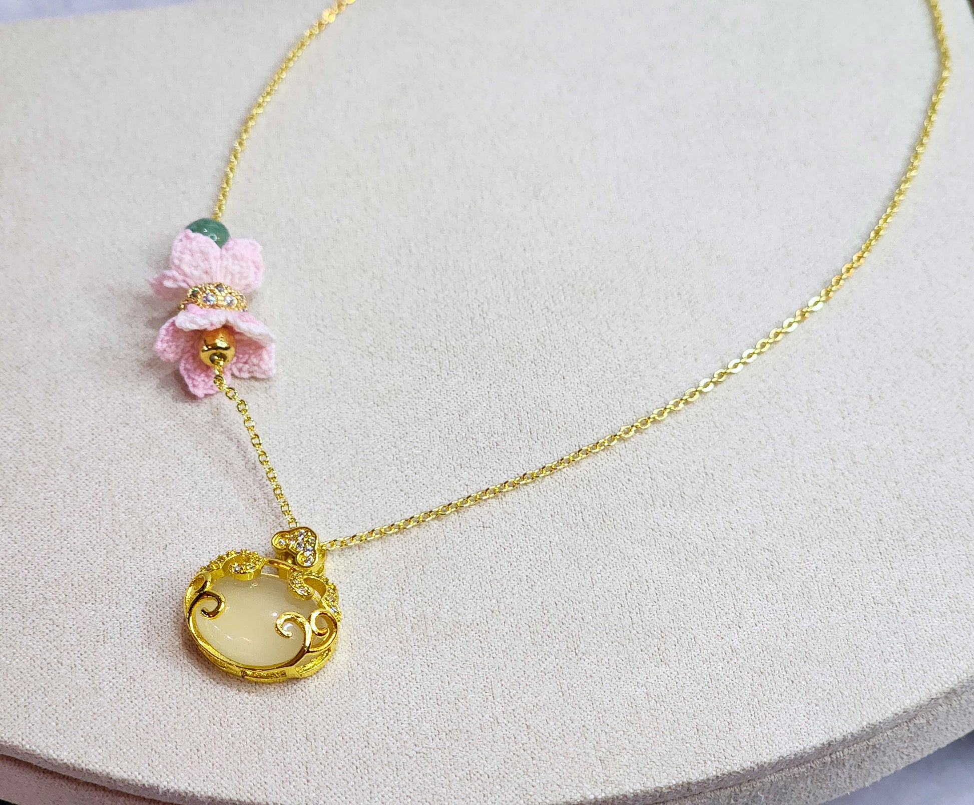 Natural Chalcedony Ruyi locket & Jadeite bead with pink micro-crochet blossoms on 18K gold-plated necklace