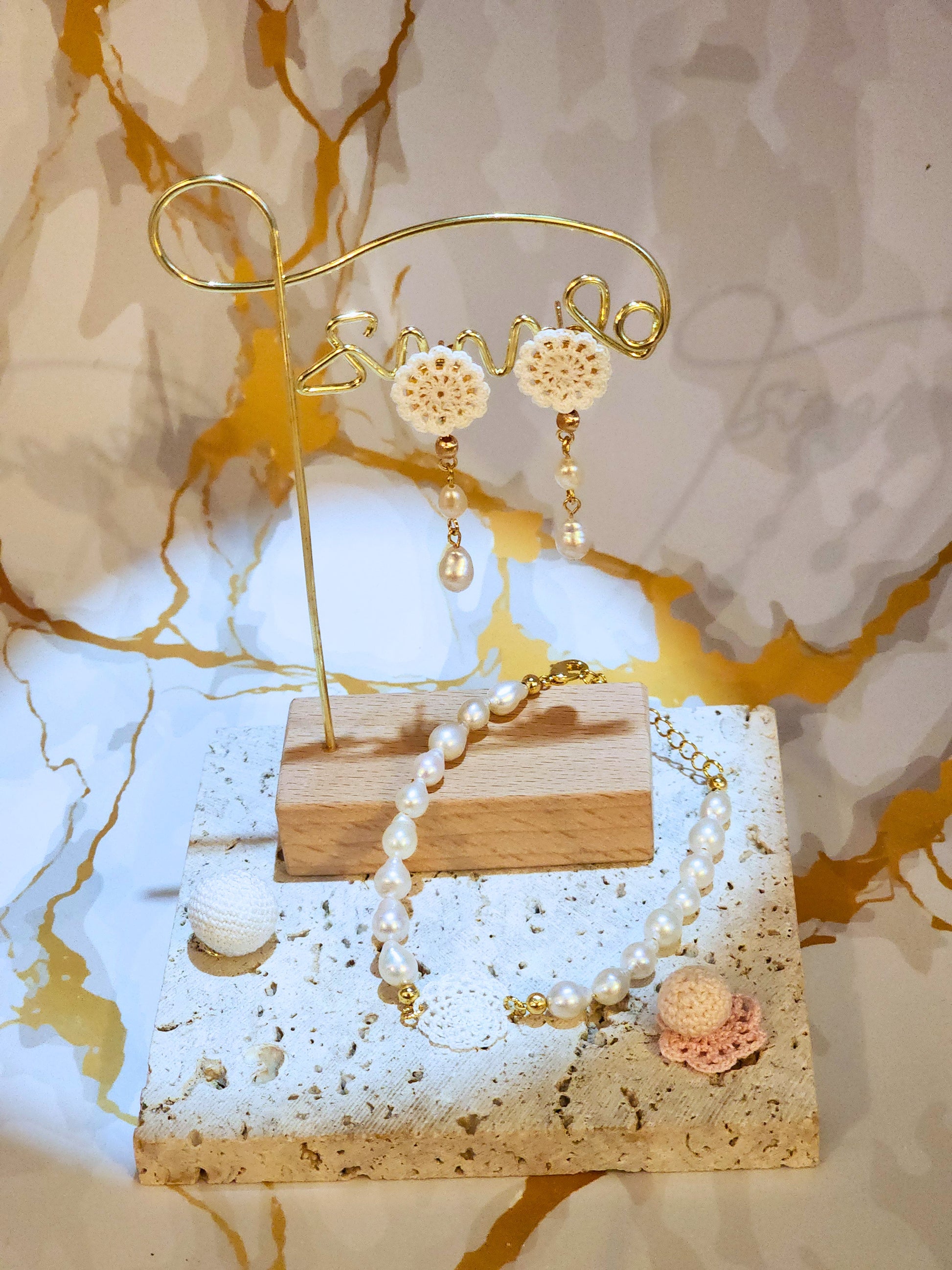 Handcrafted lace motif, beautifully framed by flawless 7–8mm teardrop-shaped pearls bracelet. Styled with 18K gold-plated bead accents and clasp.