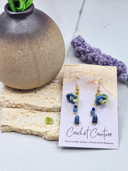 Handcrafted Lily of the Valley blooms are crowned with glowing 6mm freshwater Aurora pearls and accented with natural Lapis Lazuli and Aquamarine. 18K gold-plated.
