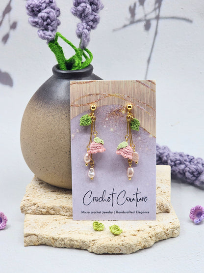 Handcrafted micro crochet Lily of the Valley blooms earrings. Paired with lustrous 6–8mm freshwater Aurora pearls and naturally formed 4–5mm pink-purple baroque pearls. 18K gold-plated.