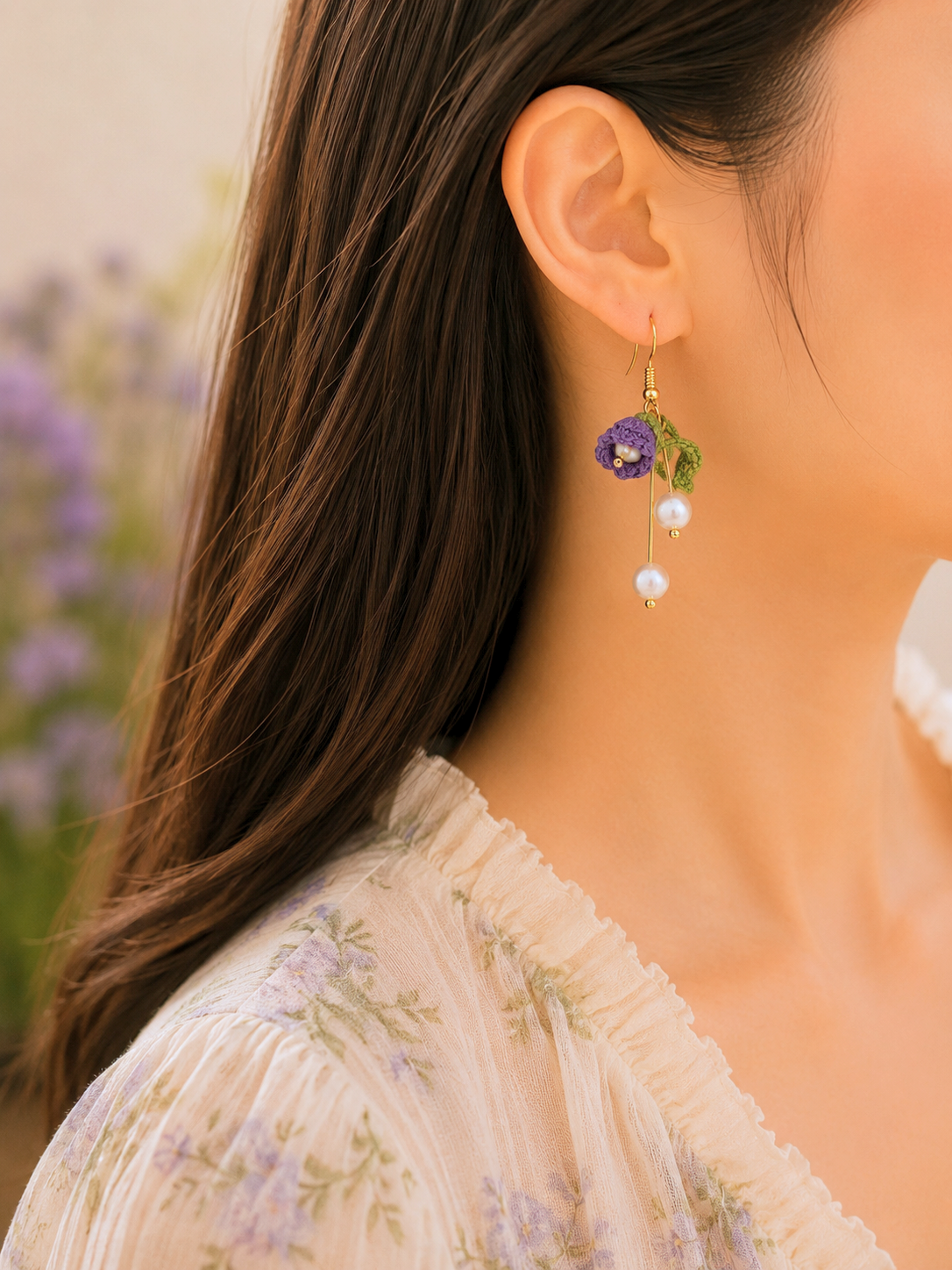 Deep purple micro crochet Lily of the Valley blooms cascade elegantly with shimmering 6mm freshwater Aurora pearls. Finished with 18K gold-plated hooks.