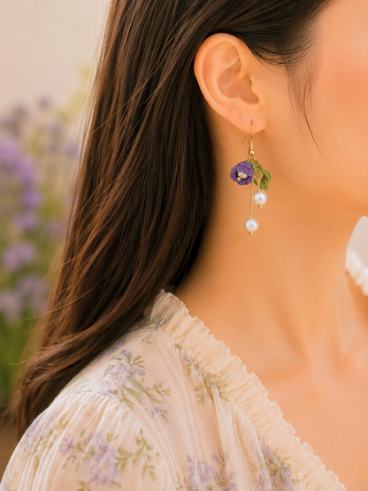 Deep purple micro crochet Lily of the Valley blooms cascade elegantly with shimmering 6mm freshwater Aurora pearls. Finished with 18K gold-plated hooks.