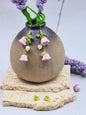A pair of handcrafted pink micro crochet Lily of the Valley blooms sway delicately with luminous 6mm freshwater Aurora pearls. Finished with gold vermeil hooks.