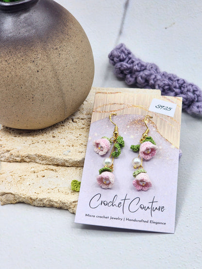 A pair of handcrafted pink micro crochet Lily of the Valley blooms sway delicately with luminous 6mm freshwater Aurora pearls. Finished with gold vermeil hooks.