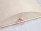 Lustrous pearl ring with pink handcrafted micro-crochet peach blossoms. 14K gold-plated adjustable ring.  