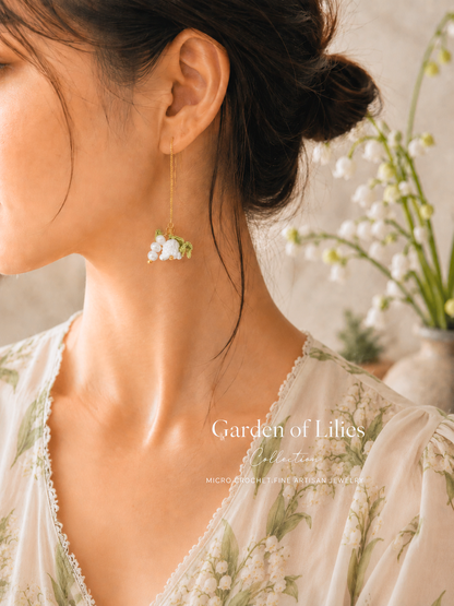 Handcrafted micro crochet Lily of the Valley blooms earrings crowned with luminous 5–6mm freshwater baroque pearls and 4–5mm stacked baroque ones. 18K gold-plated tassel earrings. 