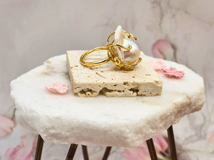 A grand 19x25mm Baroque Pearl Ring. Lustrous with a pink overtone. Flawless. Set on an 18K gold-plated band with intricate detailing. 
