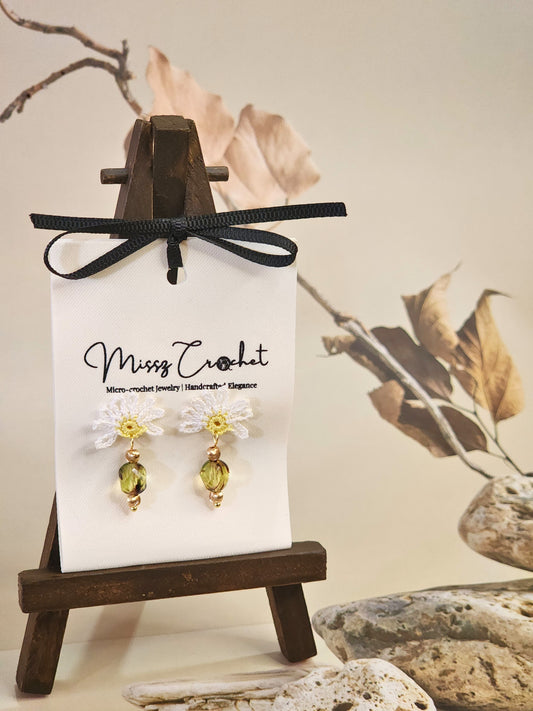 Handcrafted half daisy micro-crochet earrings with green hexagonal Czech glass bead. Styled with 18K gold-plated beads and studs 