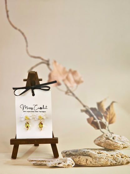 Handcrafted half daisy micro-crochet earrings with green hexagonal Czech glass bead. Styled with 18K gold-plated beads and studs