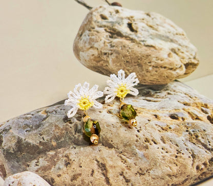 Handcrafted half daisy micro-crochet earrings with green hexagonal Czech glass bead. Styled with 18K gold-plated beads and studs