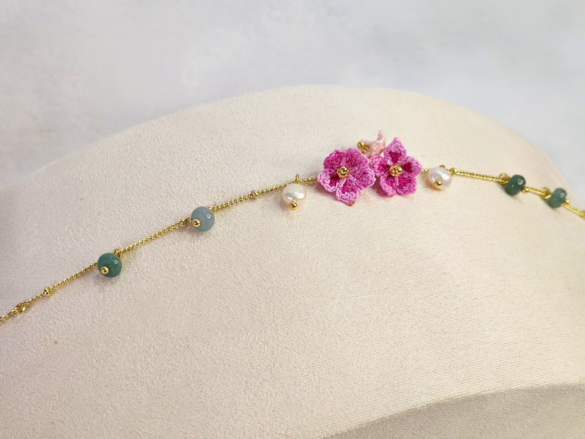 Natural Jadeite and Pearl bracelet with pink handcrafted micro-crochet peach blossoms on 18K gold-plated bracelet
