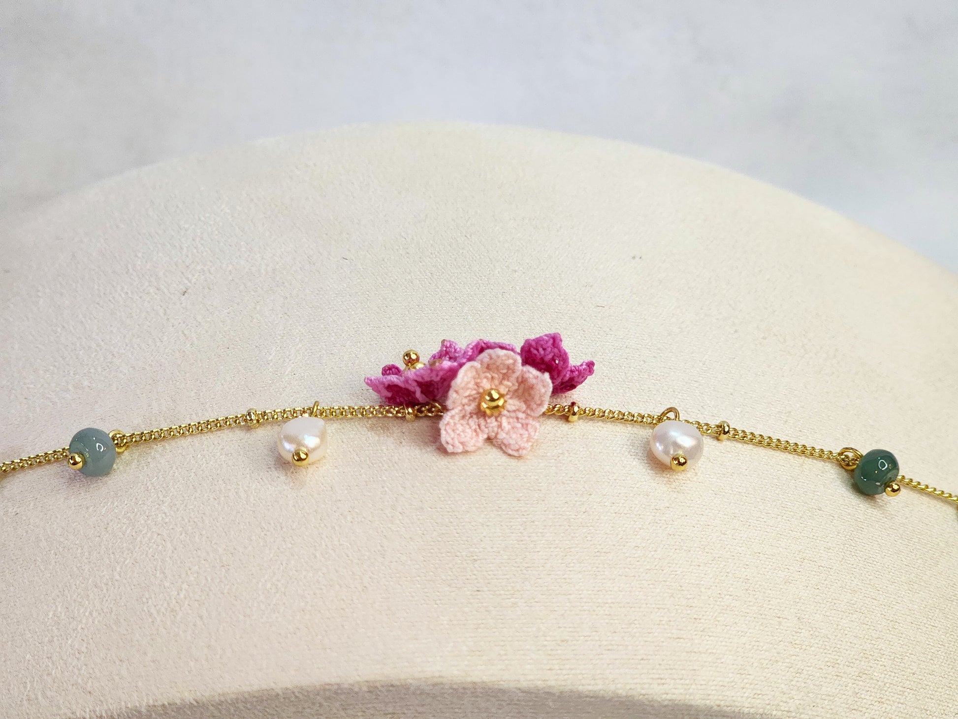 Natural Jadeite and Pearl bracelet with pink handcrafted micro-crochet peach blossoms on 18K gold-plated bracelet
