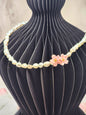 Full strand necklace. 6–7mm Keshi pearls, each one uniquely shaped and glowing with exceptional lustre. Accented with delicate micro crochet Sakura blossoms. 