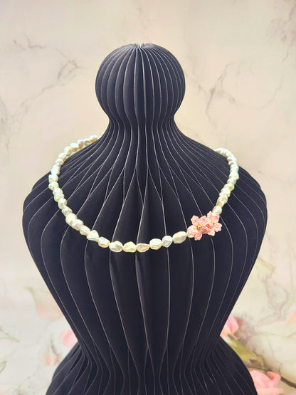Full strand necklace. 6–7mm Keshi pearls, each one uniquely shaped and glowing with exceptional lustre. Accented with delicate micro crochet Sakura blossoms. 