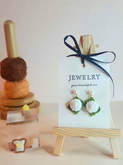 Kueh Tu Tu micro-crochet earrings adorned with 4-5mm AAA grade natural freshwater pearls and paired with 18KGP ear studs