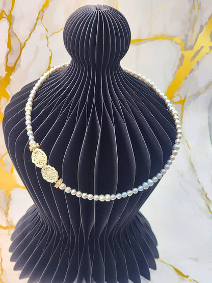 Handcrafted lace motifs paired with luminous 4-6mm silver-grey baroque pearls necklace. Accented with gold-plated cubic zirconia beads and S925 clasp.