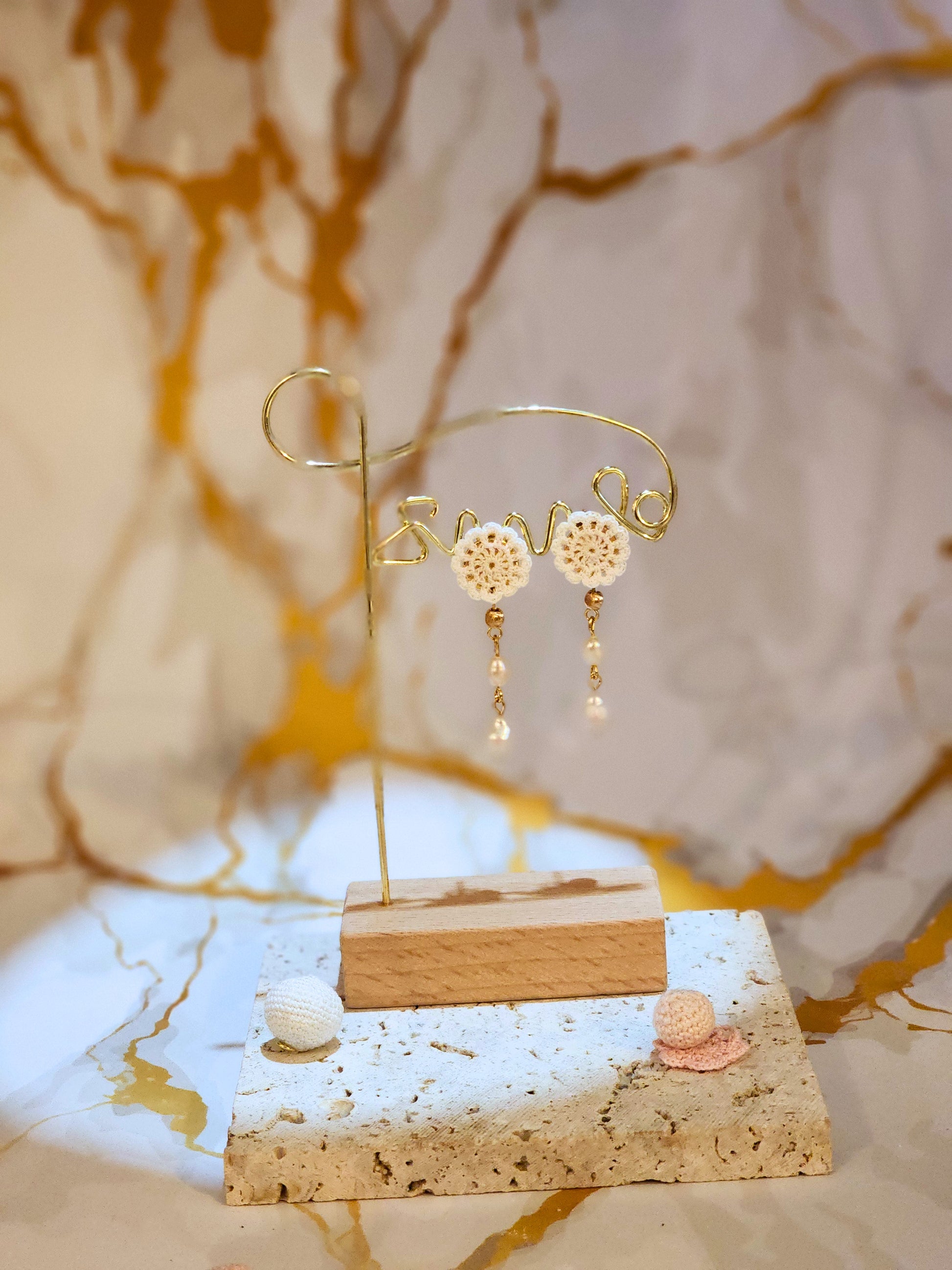 Handcrafted micro crochet lace motif, paired with double teardrop-shaped pearls. Styled with 18K gold-plated findings and studs.
