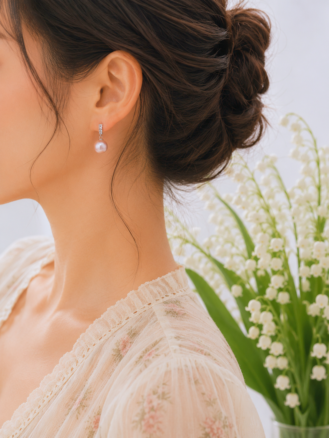 Luminous metallic freshwater Edison pearls earrings. Exceptional lustre, generous size, and radiant metallic overtones. Finished with elegant white gold-plated hooks adorned with sparkling cubic zirconia.