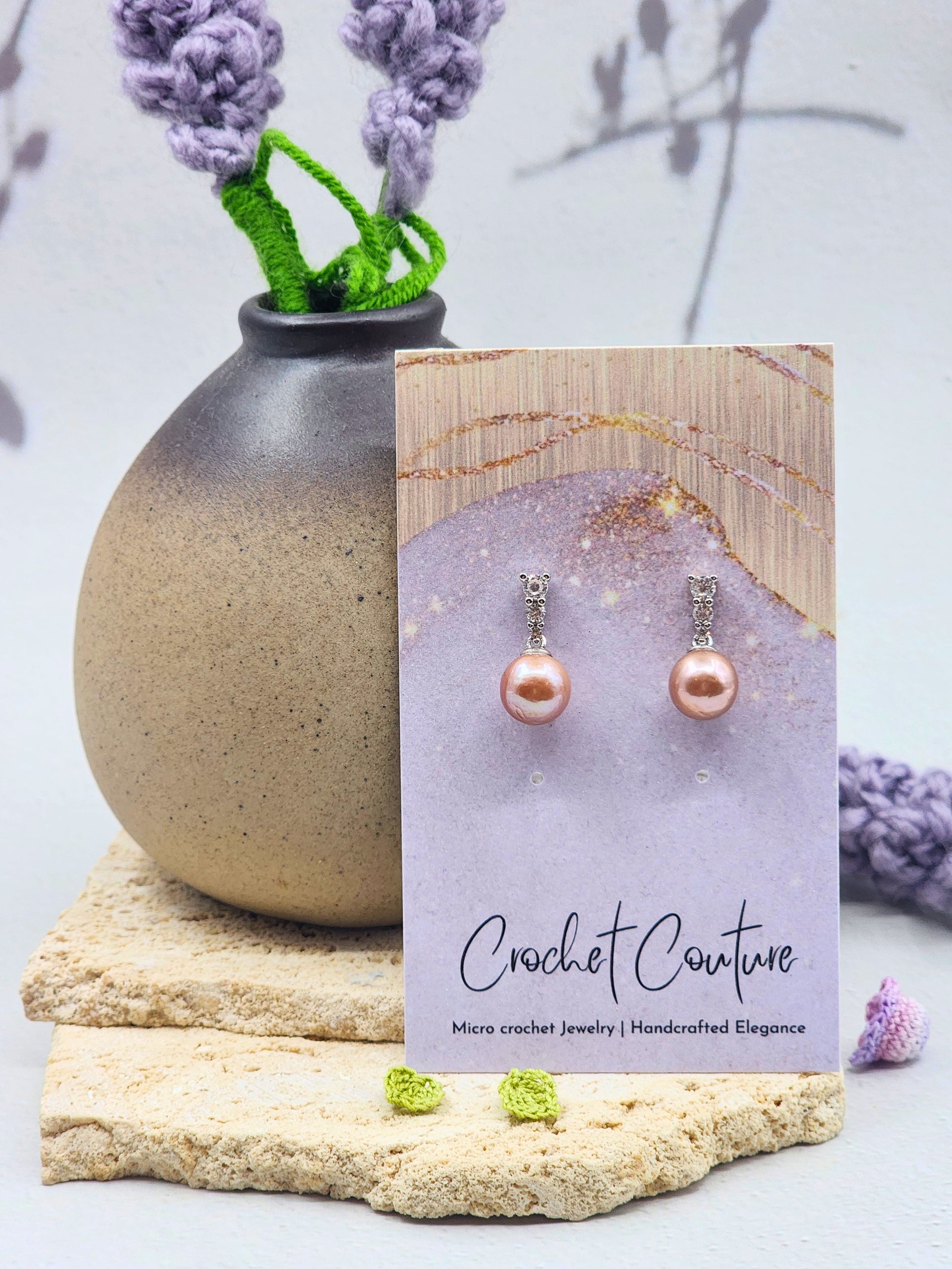 Luminous metallic freshwater Edison pearls earrings. Exceptional lustre, generous size, and radiant metallic overtones. Finished with elegant white gold-plated hooks adorned with sparkling cubic zirconia.