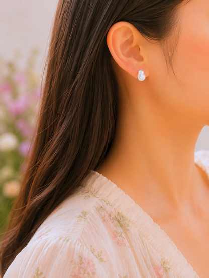 Lustrous 6-8mm freshwater Keshi pearls. Finished with gold vermeil studs. 