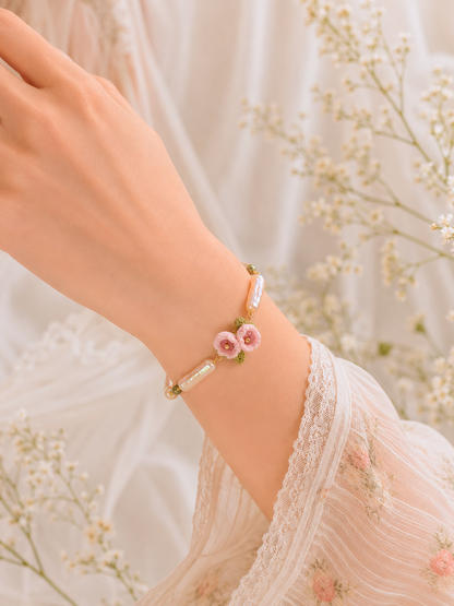 Handcrafted micro crochet Lily of the Valley blooms paired with pink-gold metallic Pipa pearls bracelet