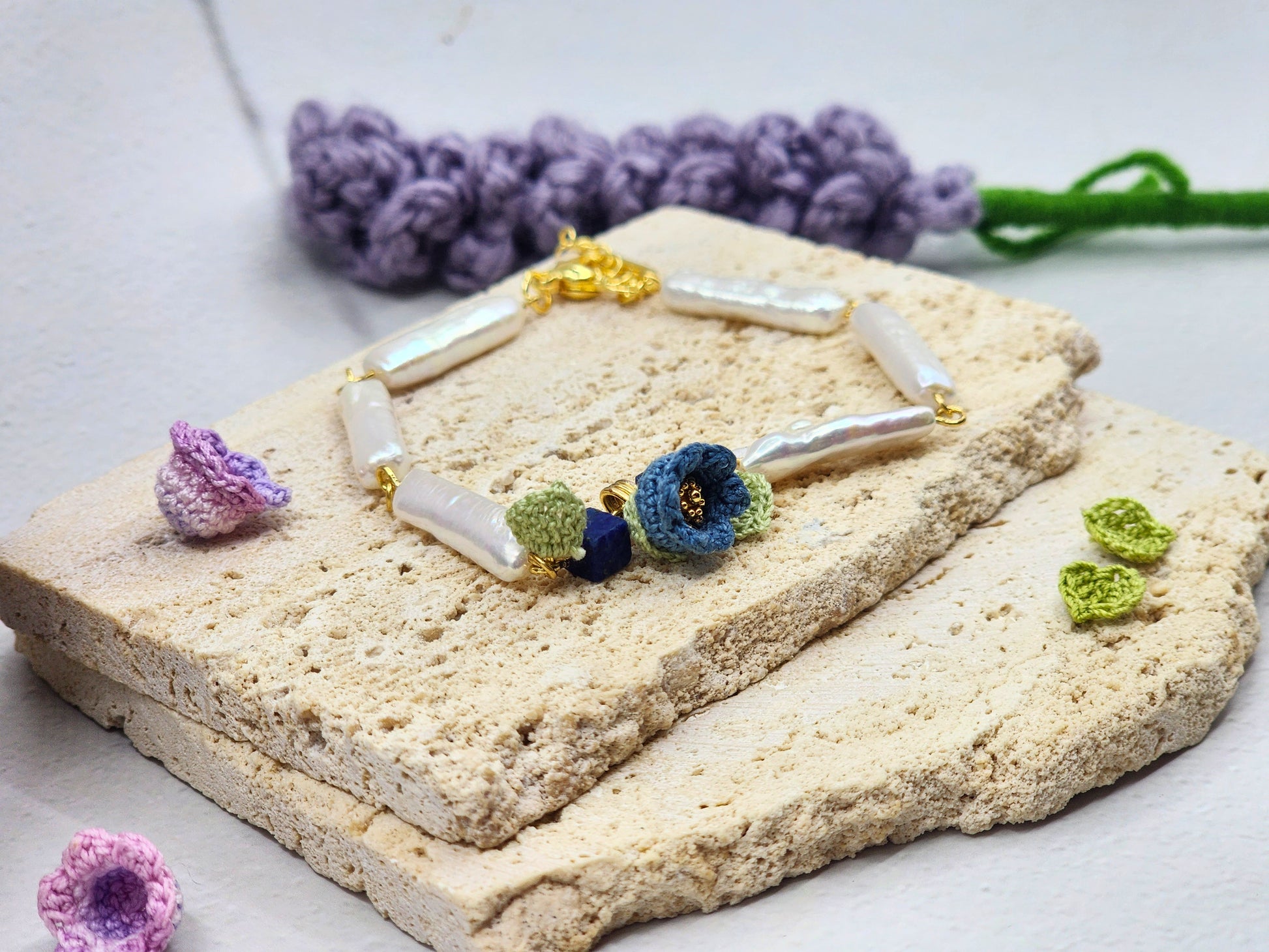 Handcrafted micro crochet Lily of the Valley blooms with beautifully satin-like >15mm white Pipa pearls and natural Lapis Lazuli bracelet. 