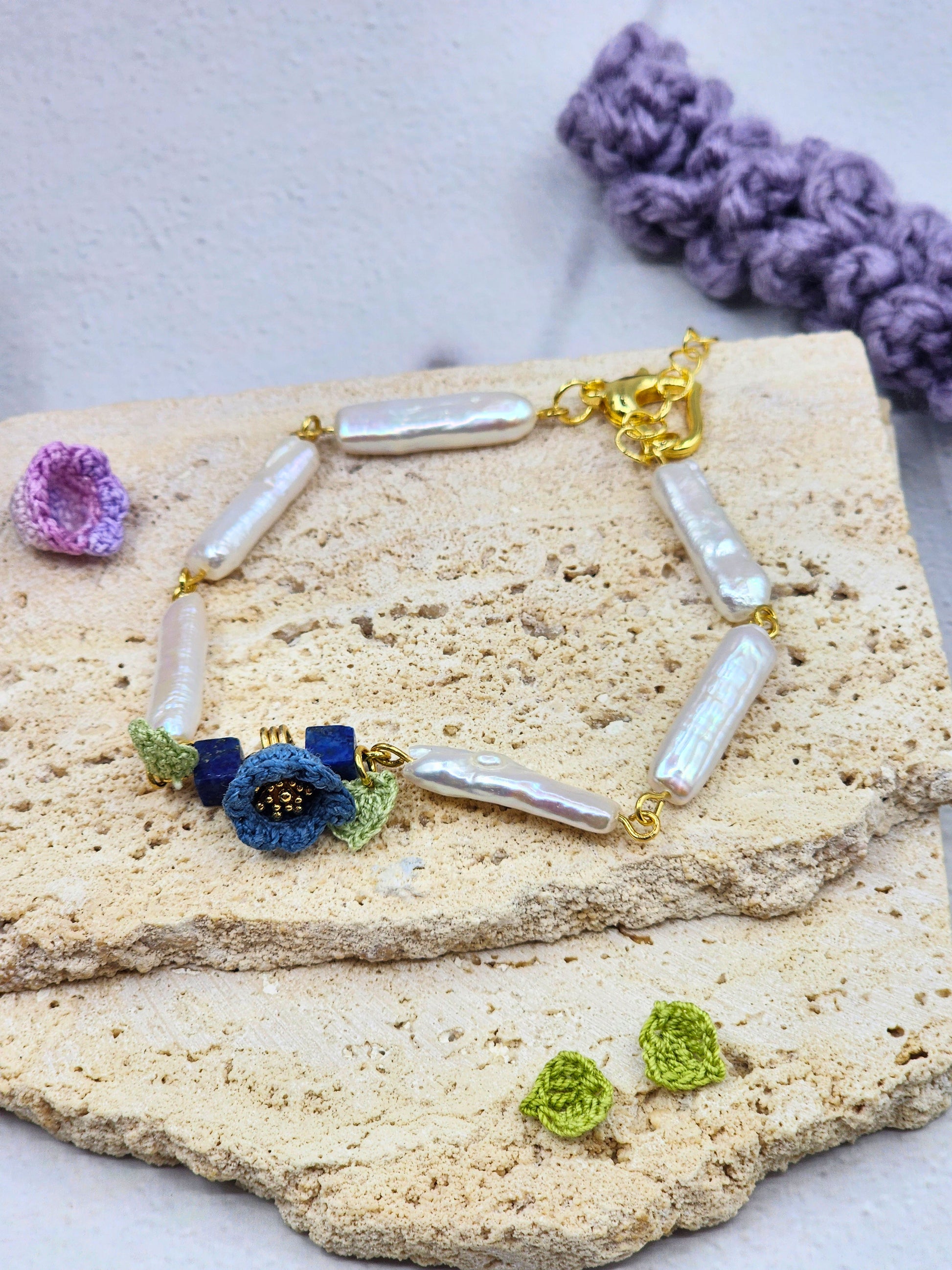 Handcrafted micro crochet Lily of the Valley blooms with beautifully satin-like >15mm white Pipa pearls and natural Lapis Lazuli bracelet.