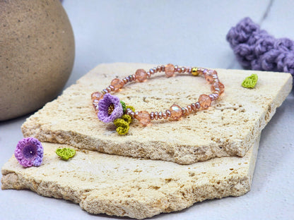 Handcrafted micro crochet Lily of the Valley bloom bracelet beautifully complemented by radiant 3–4mm metallic baroque pearls and sparkling Czech crystals.