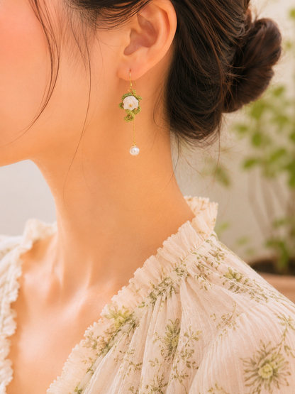 Handcrafted micro crochet Lily of the Valley blooms accented with 6–7mm freshwater Akoya teardrop pearls and luminous 6mm freshwater Aurora pearls. Gold vermeil hooks. 