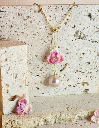 Close up of a Pink-White Orchid mIcro-crochet necklace with 12mm pink-purple Aurora grade natural freshwater pearl 