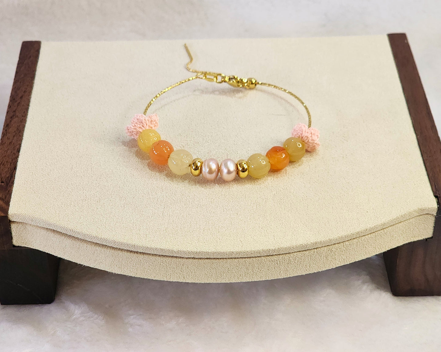 Natural quartz crystals and pearls bracelet with pink handcrafted micro-crochet peach blossoms on 18K gold-plated bracelet.