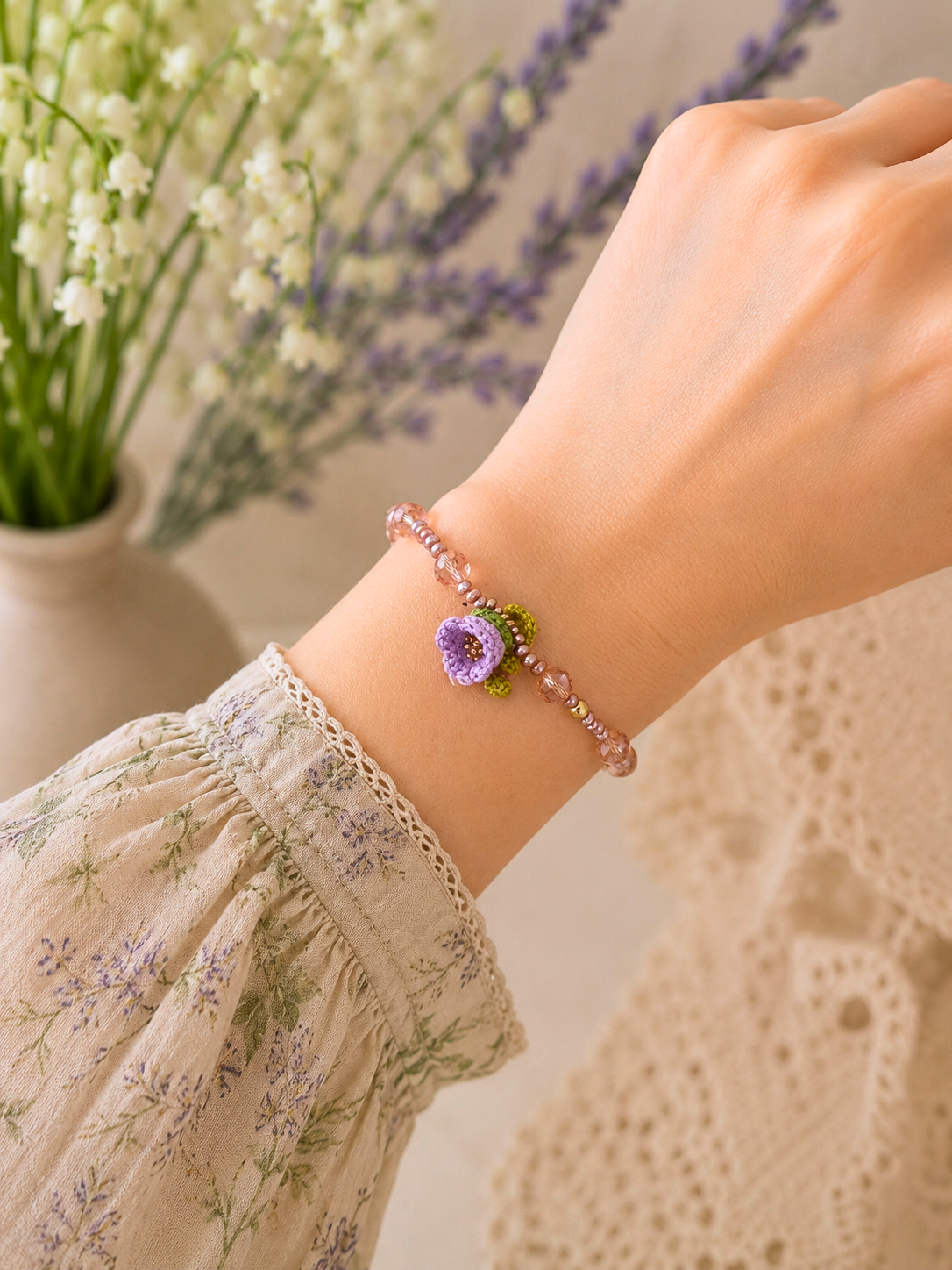 Handcrafted micro crochet Lily of the Valley bloom bracelet beautifully complemented by radiant 3–4mm metallic baroque pearls and sparkling Czech crystals.