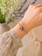 Handcrafted micro crochet Lily of the Valley bloom bracelet beautifully complemented by radiant 3–4mm metallic baroque pearls and sparkling Czech crystals.