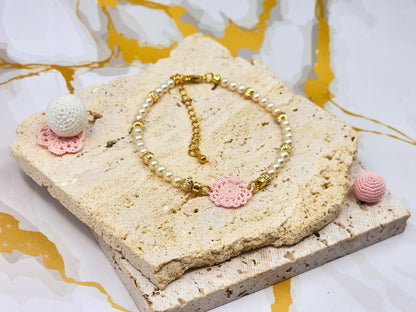Handcrafted lace motif, beautifully framed by 4–5mm high lustre, flawless freshwater pearl. 18K gold-plated bead accents and clasp.