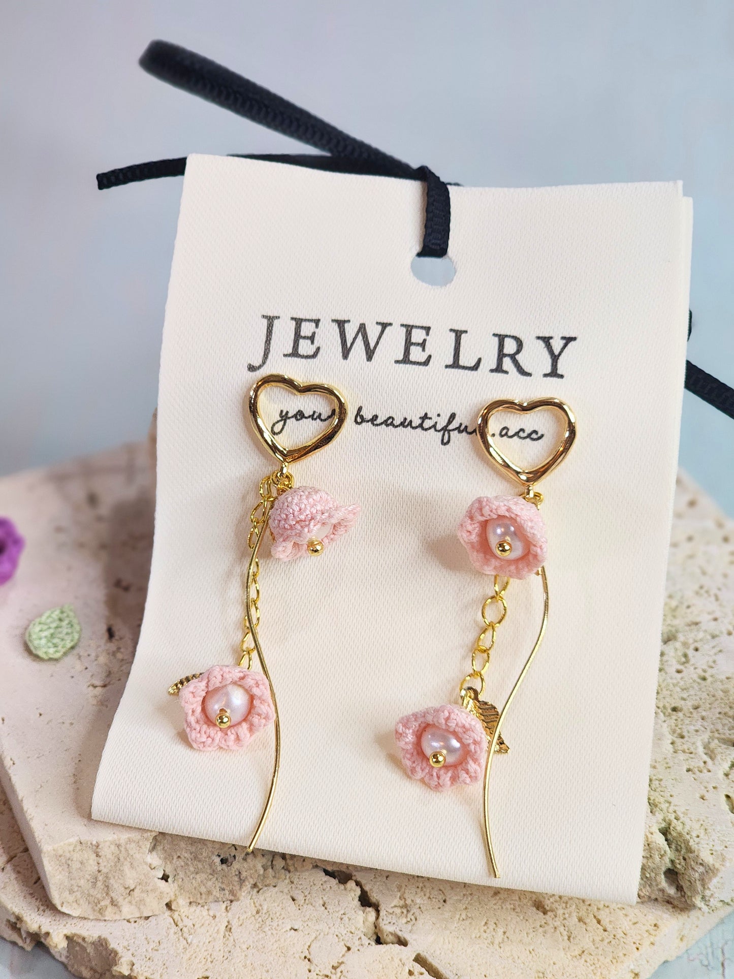 Handcrafted micro-crochet pink Lilies of the Valley with freshwater pearls earrings, paired with 18K gold-plated heart-shaped studs and findings