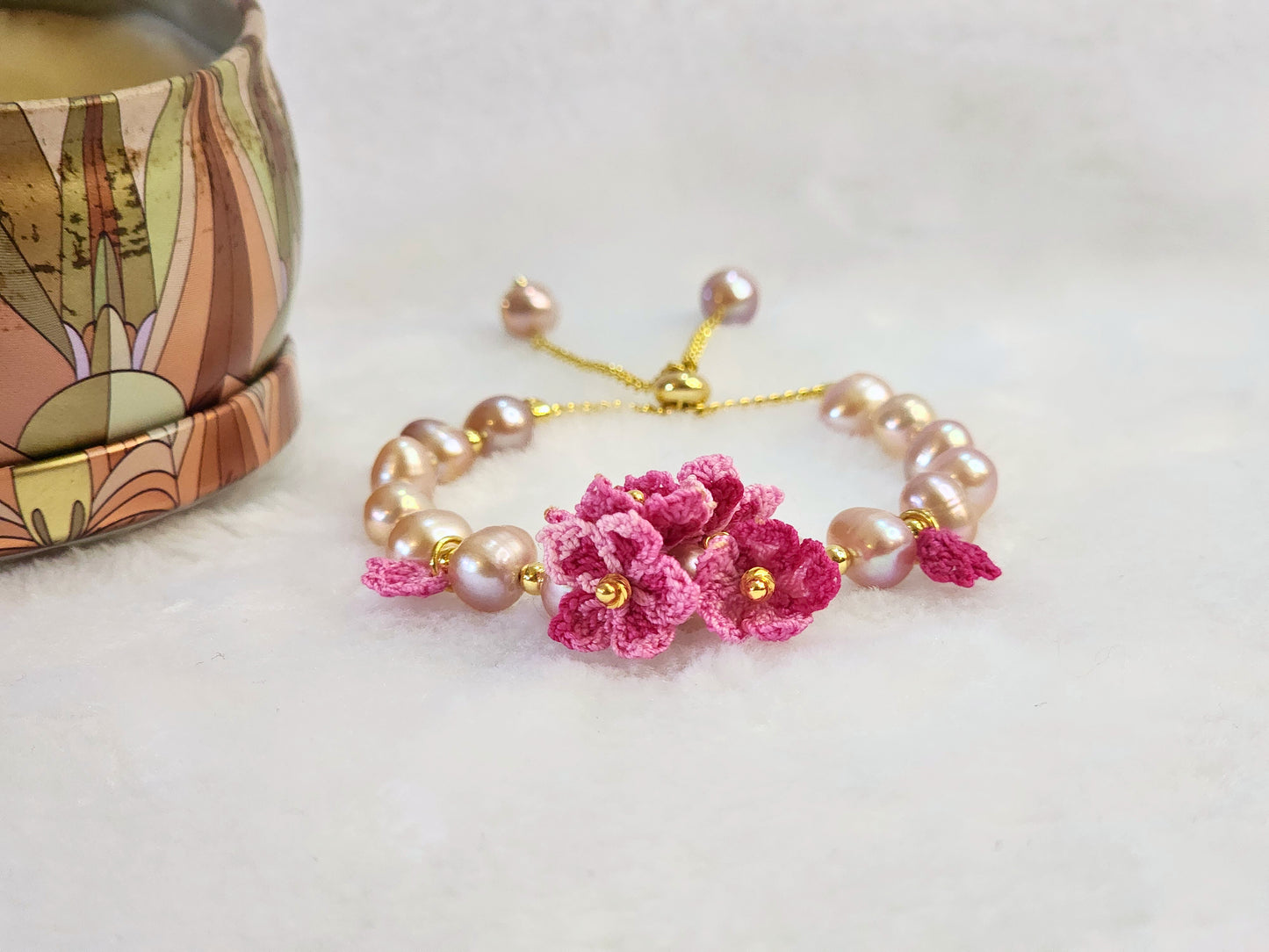Purple natural Baroque pearl bracelet with pink micro-crochet peach blossoms on 18K gold-plated bracelet.