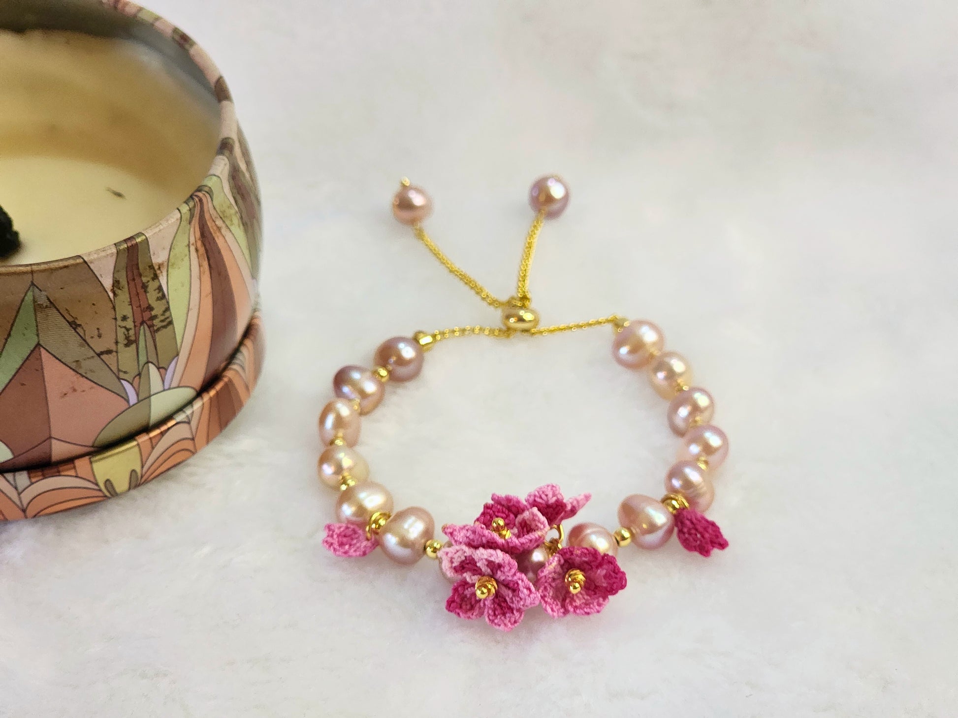 Purple natural Baroque pearl bracelet with pink micro-crochet peach blossoms on 18K gold-plated bracelet.