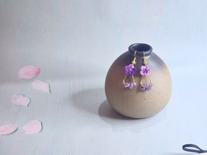 Handcrafted micro-crochet star flowers earrings with natural Amethyst crystals and Miyuki glass beads from Japan. 18K gold-plated ear hooks.