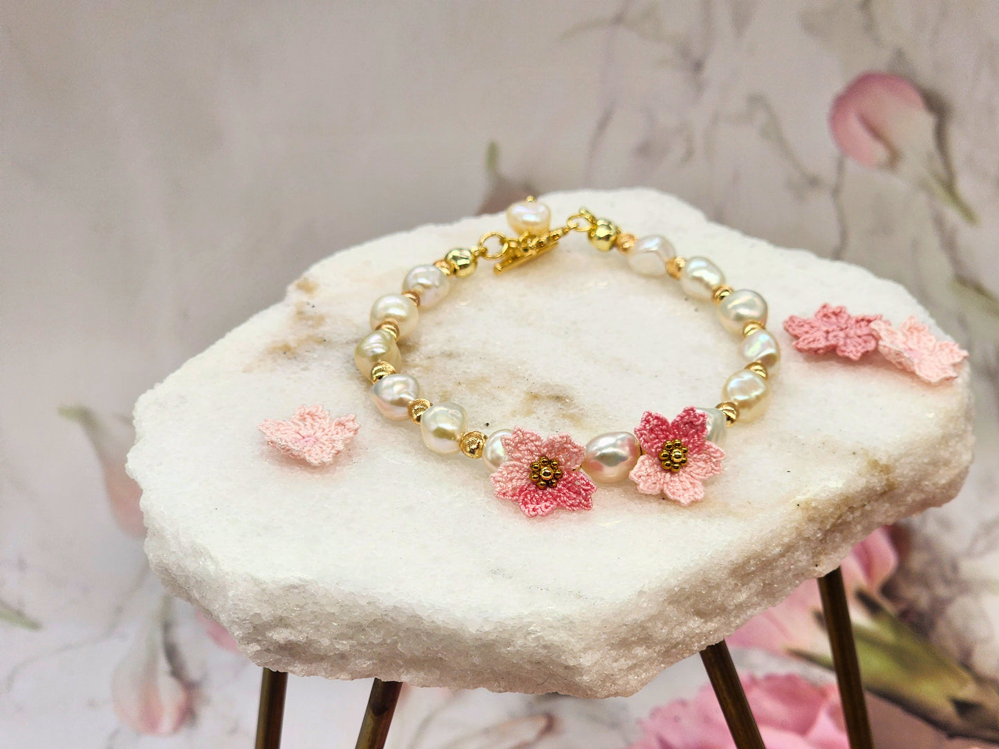 Radiant 7-8mm Keshi pearls & micro crochet Sakura blossoms bracelet. 18K gold-plated jewelry wire, bold spacer beads, and chain clasp.