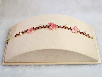 Natural red garnet crystals and pearls bracelet with handcrafted micro-crochet peach blossoms on 18K gold-plated bracelet