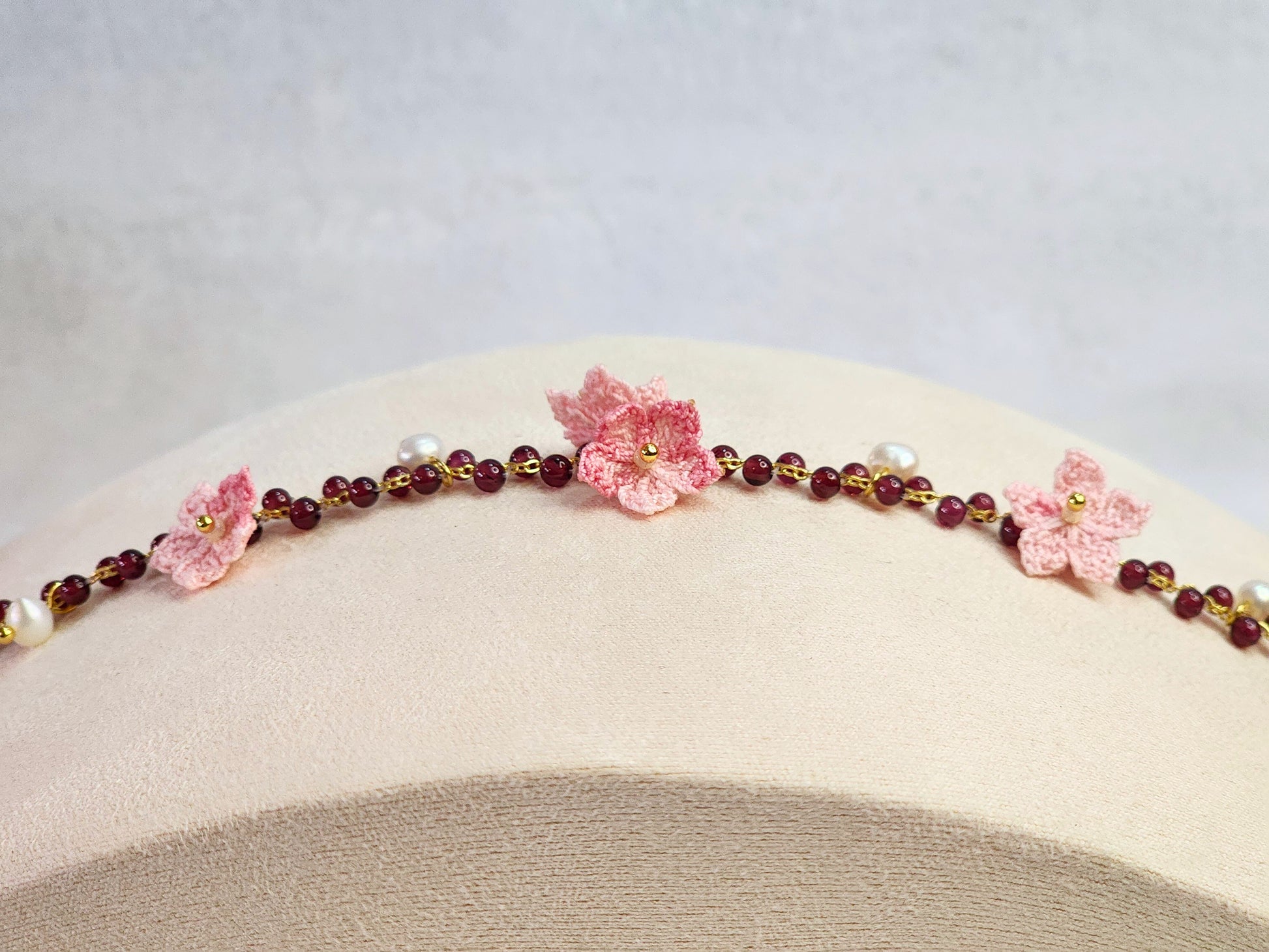 Natural red garnet crystals and pearls bracelet with handcrafted micro-crochet peach blossoms on 18K gold-plated bracelet
