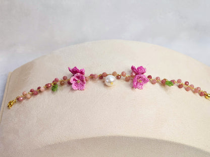 Natural Rhodochrosite crystal and pearl bracelet with handcrafted pink micro-crochet peach blossoms on an 18K gold-plated bracelet.